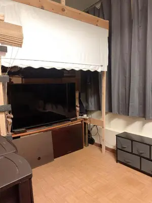 a living room with a large flat screen tv at Near Seaport In Chinatown in New York