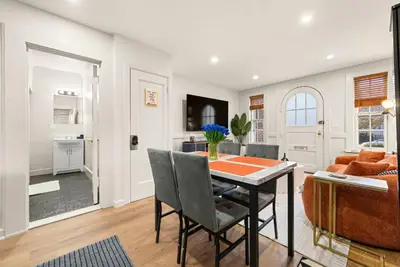 a kitchen and dining room with a table and chairs at FIFA26|Based Btwn MetLife & Manhattan|Parking in Bayonne