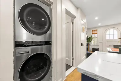 a kitchen with a washing machine in a wall at FIFA26|Based Btwn MetLife & Manhattan|Parking in Bayonne