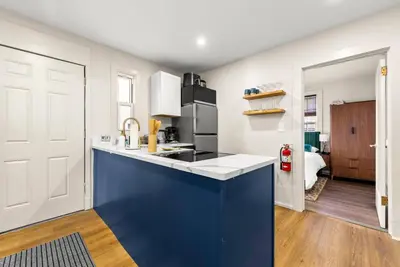 a kitchen with a blue and white counter top at FIFA26|Based Btwn MetLife & Manhattan|Parking in Bayonne