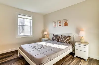 a bedroom with a bed and a window at Pet-Friendly Group Getaway 12 Mi to Camelback Mtn! in Cresco