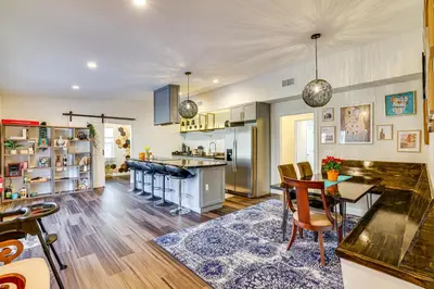 a kitchen and dining room with a table and chairs at Pet-Friendly Group Getaway 12 Mi to Camelback Mtn! in Cresco