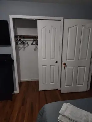 a bedroom with two white doors and a closet at 2 Beds - Work & Study - NYC - EWR - Walk to Train in East Newark