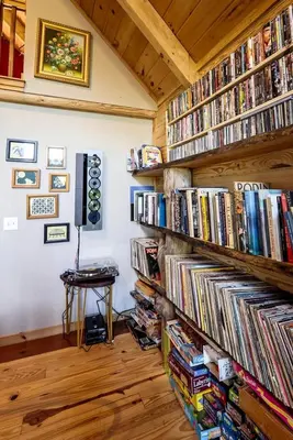 a room with several shelves filled with dvds at Luxurious Log Cabin with Game Room & Fireplace near Princeton in New Hope, Pennsylvania in New Hope