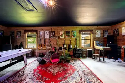 a living room with a ping pong table and a ping pong table at Luxurious Log Cabin with Game Room & Fireplace near Princeton in New Hope, Pennsylvania in New Hope