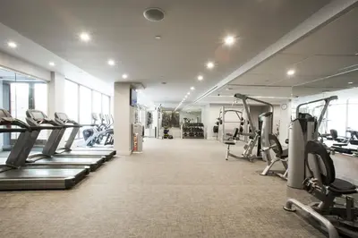 a gym with treadmills and cardio equipment in a building at Central Chelsea 1BR w Gym Doorman NYC-20 in New York