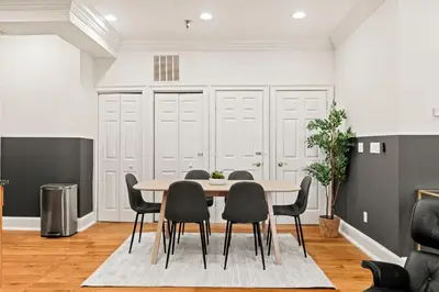a dining room with a table and chairs at Apartmint at 113 Chestnut - Philadelphia in Philadelphia