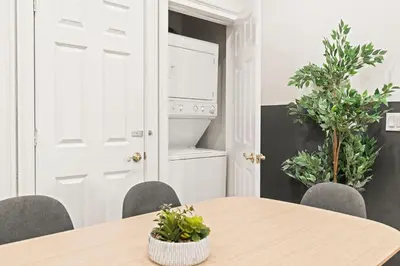 a dining room with a table and chairs at Apartmint at 113 Chestnut - Philadelphia in Philadelphia