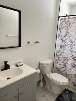 a bathroom with a sink and a toilet and a shower at 730 Seaport Drive in Elizabeth