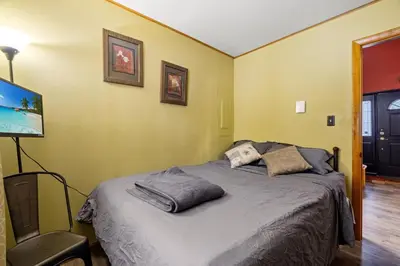 a bedroom with a bed with two pillows on it at Hot Tub + Fire Pit • Game Room • Community Pool in Tobyhanna
