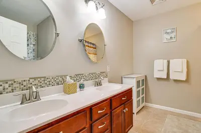 a bathroom with a sink and a mirror at Fire Pit, Games and Outdoor Fun! Poconos Retreat in Blakeslee