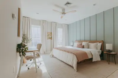 a bedroom with a bed and a desk in it at Maisonette on Duke - Downtown in Lancaster