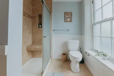 a bathroom with a toilet and a shower at Maisonette on Duke - Downtown in Lancaster