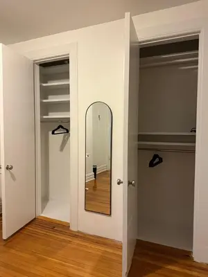 a mirror in a room with two closets at The Broadway Escape - Private Room in Times Square in New York