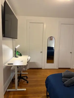 a bedroom with a desk and a bed and a desk and a computer at The Broadway Escape - Private Room in Times Square in New York
