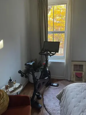 a room with a exercise bike in front of a window at Cosy apartment in prime West Village in New York
