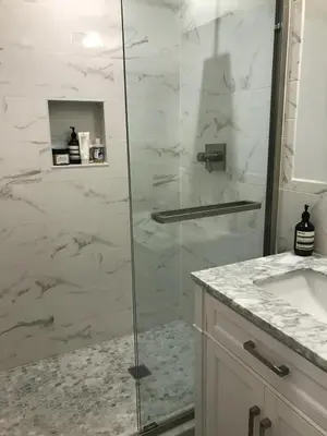 a bathroom with a glass shower and a sink at Cosy apartment in prime West Village in New York