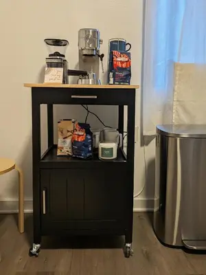 a black cart with a table with food on it at The Black Bellvue NYC in New York