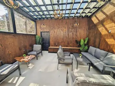 a living room with a couch and chairs and a table at Family-Friendly 2BR, NYC Access in Minutes in Hoboken