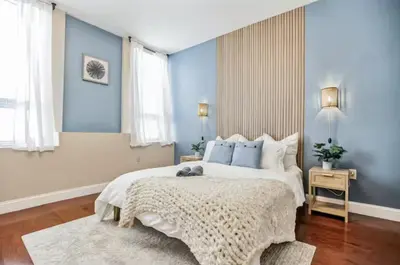 a bedroom with a large white bed with blue walls at Luxury 3 Bedroom - Perfect Center City Location - 501 in Philadelphia