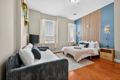 a living room with two beds and a couch at Luxury 3 Bedroom - Perfect Center City Location - 501 in Philadelphia