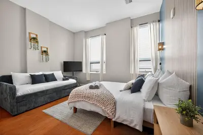 a bedroom with a bed and a couch at Luxury 3 Bedroom - Perfect Center City Location - 501 in Philadelphia