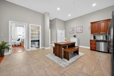 a kitchen with a wooden table in a room at Luxury 3 Bedroom - Perfect Center City Location - 501 in Philadelphia