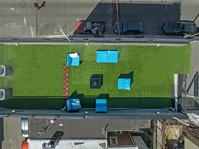an overhead view of a building with blue chairs on it at Skyline Escape in Philadelphia Chic & Bright in Philadelphia