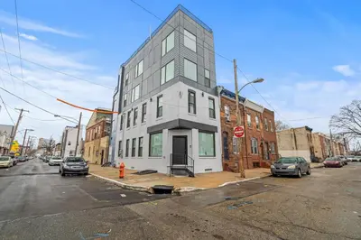 a tall white building on a city street at Skyline Escape in Philadelphia Chic & Bright in Philadelphia