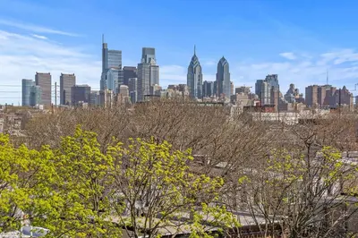 a view of a city skyline with trees and buildings at Skyline Escape in Philadelphia Chic & Bright in Philadelphia