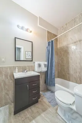 a bathroom with a sink and a toilet and a tub at Modern 2 bedroom - Center City Philadelphia in Philadelphia