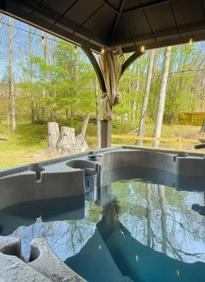 a swimming pool in the middle of a yard at 6000sf Luxe Estate Pond|Tennis|Sauna|Hottub|Movie in East Stroudsburg