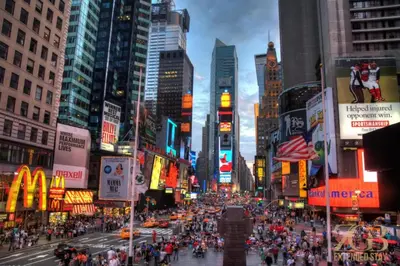 a busy city street with a crowd of people at 517 -41D Gorgeous and Fully Equipped Luxury 1 Bedroom Apt in New York
