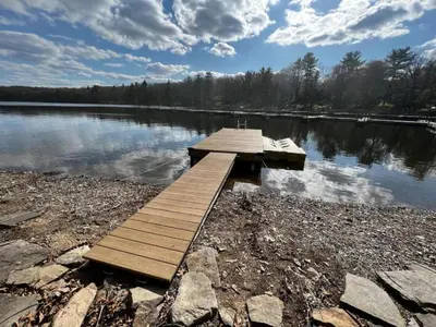 a wooden dock on the shore of a lake at Lakefront Paradise near everything! in Hawley