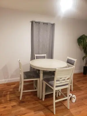 a white table and chairs in a room at Deluxe 3 bedroom in Newark