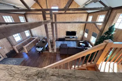 a view of a living room in a wooden cabin at Spacious Barn House experience! in Hellertown