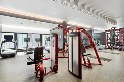 a gym with cardio equipment in a room at FiDi Studio with Work Setup by Anyplace - 8827 in New York