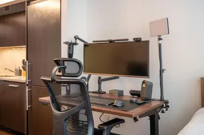 a desk with a computer monitor and a chair at FiDi Studio w Work Setup by Anyplace - 10254 in New York