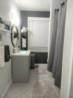 a bathroom with a sink and a mirror at Belmont Place in Wilmington