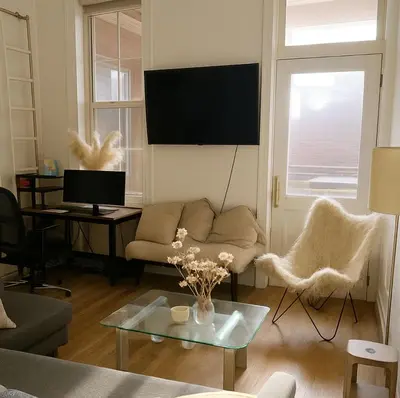 a living room with a couch and a table at Noho Luxury Building 1Br with Living room with Pool and First Floor in New York