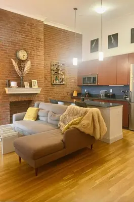 a living room with a couch and a kitchen at Noho Luxury Building 1Br with Living room with Pool and First Floor in New York