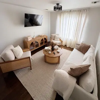 a living room with a couch and a table at 30 min from NYC luxury and chic 3 bedroom in Harrison