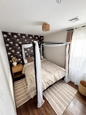 a bedroom with a bed with a canopy at 30 min from NYC luxury and chic 3 bedroom in Harrison