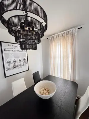 a black dining room table with a bowl of balls on it at 30 min from NYC luxury and chic 3 bedroom in Harrison