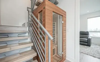 a staircase in a house with a glass door at The Executive Penn's Landing - High End Luxury 3BR-Sauna-Gym-Garage-Roof Deck in Philadelphia