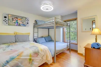 a bedroom with a bunk bed and a mirror at Game Room Retreat 5 Mi to Big Boulder Mtn in Blakeslee