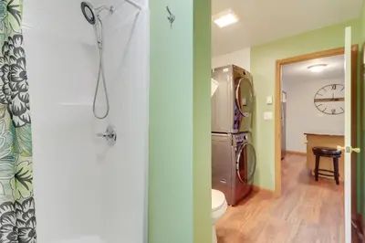 a bathroom with a toilet and a washer and dryer at Game Room Retreat 5 Mi to Big Boulder Mtn in Blakeslee