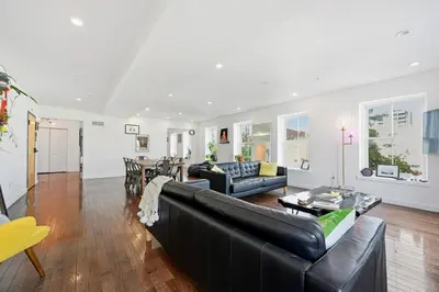 a living room with a couch and a table at Beautiful 4th Floor Walk-Up Apartment in Old City in Philadelphia