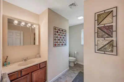 a bathroom with a sink and a toilet at Sleeps 12 Fire Pit Game Room Near Camelback in Long Pond