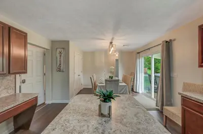 a kitchen and living room with a dining room at Sleeps 12 Fire Pit Game Room Near Camelback in Long Pond